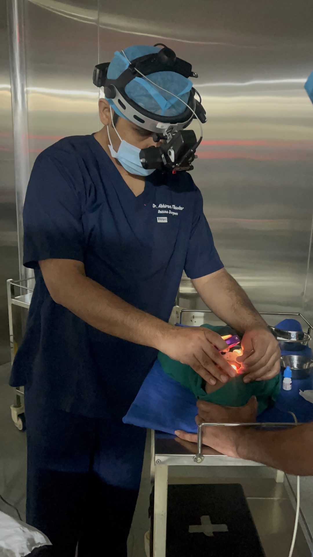Dr. Abhiram Thacker performing ROP laser treatment on a premature baby